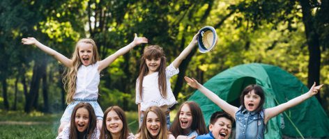 Group of girls camping in forest